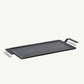 A black carbon steel griddle with raised handles, designed for use on stovetops and grills.