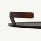 Metallic object with a handle on a white background