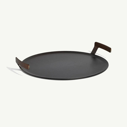 Black round tray with wooden handles on a white background