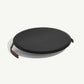 Black round lid with handles on a white background