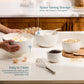 White ceramic bowls on a kitchen counter with text highlighting space-saving storage and ease of cleaning.