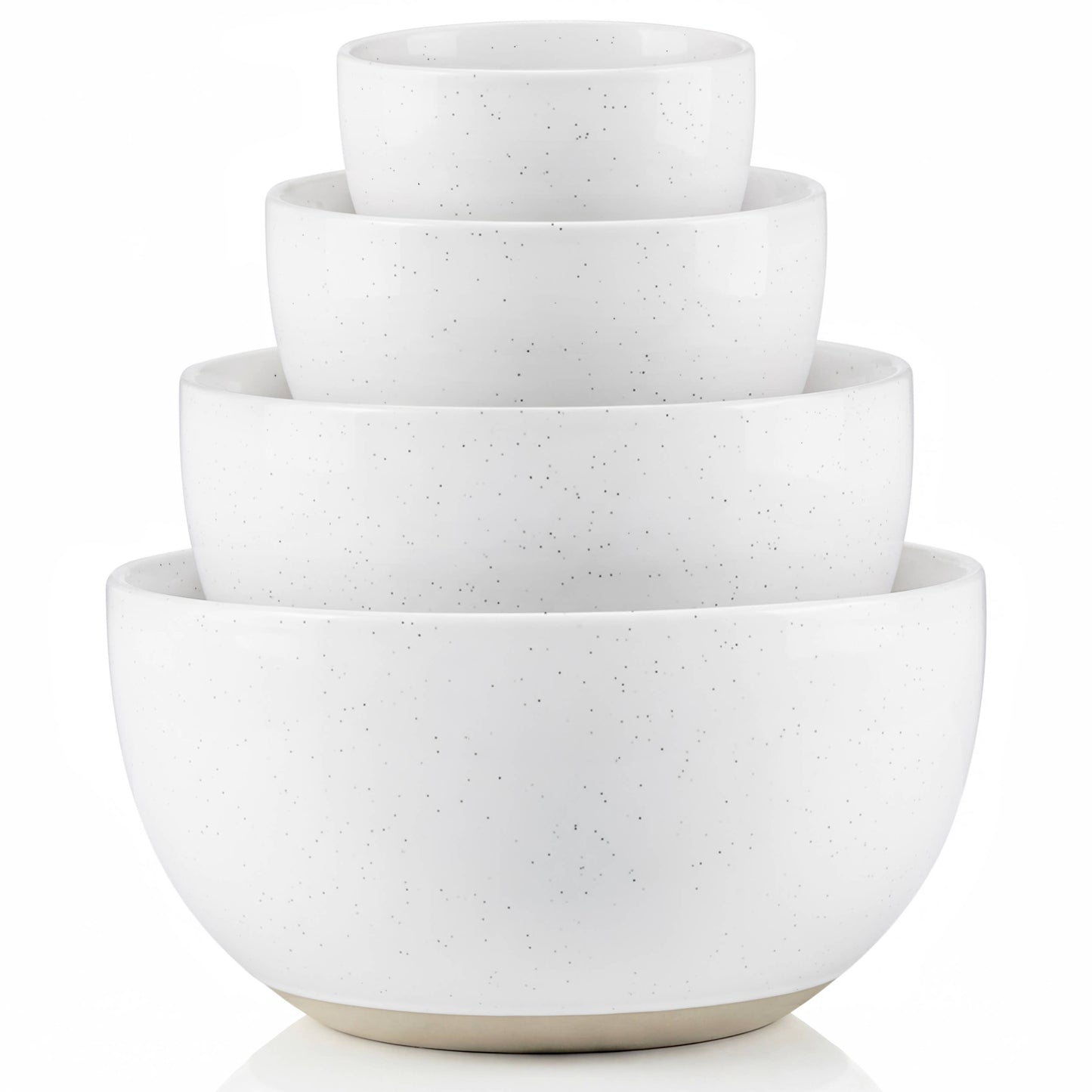 Set of four white ceramic bowls of different sizes stacked on a white background