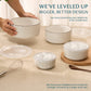 Set of ceramic bowls with geometric patterns on a beige surface, with text about improved design.