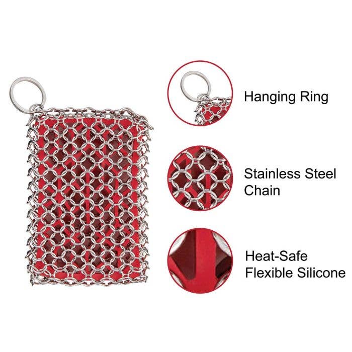 Red chainmail scrubber with hanging ring, stainless steel chain, and heat-safe flexible silicone on a white background.
