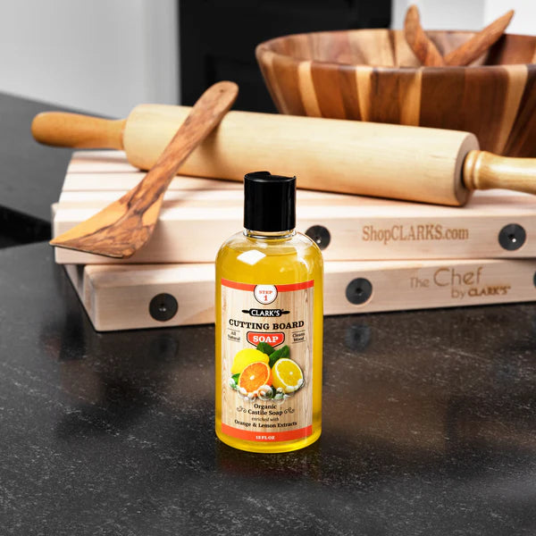 Clark's cutting board soap in front of wood products.