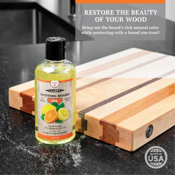 clark's cutting board oil being used on a cutting board on a counter restore the beauty of your wood bring out the board's rich natural color while protecting with a brand you trust