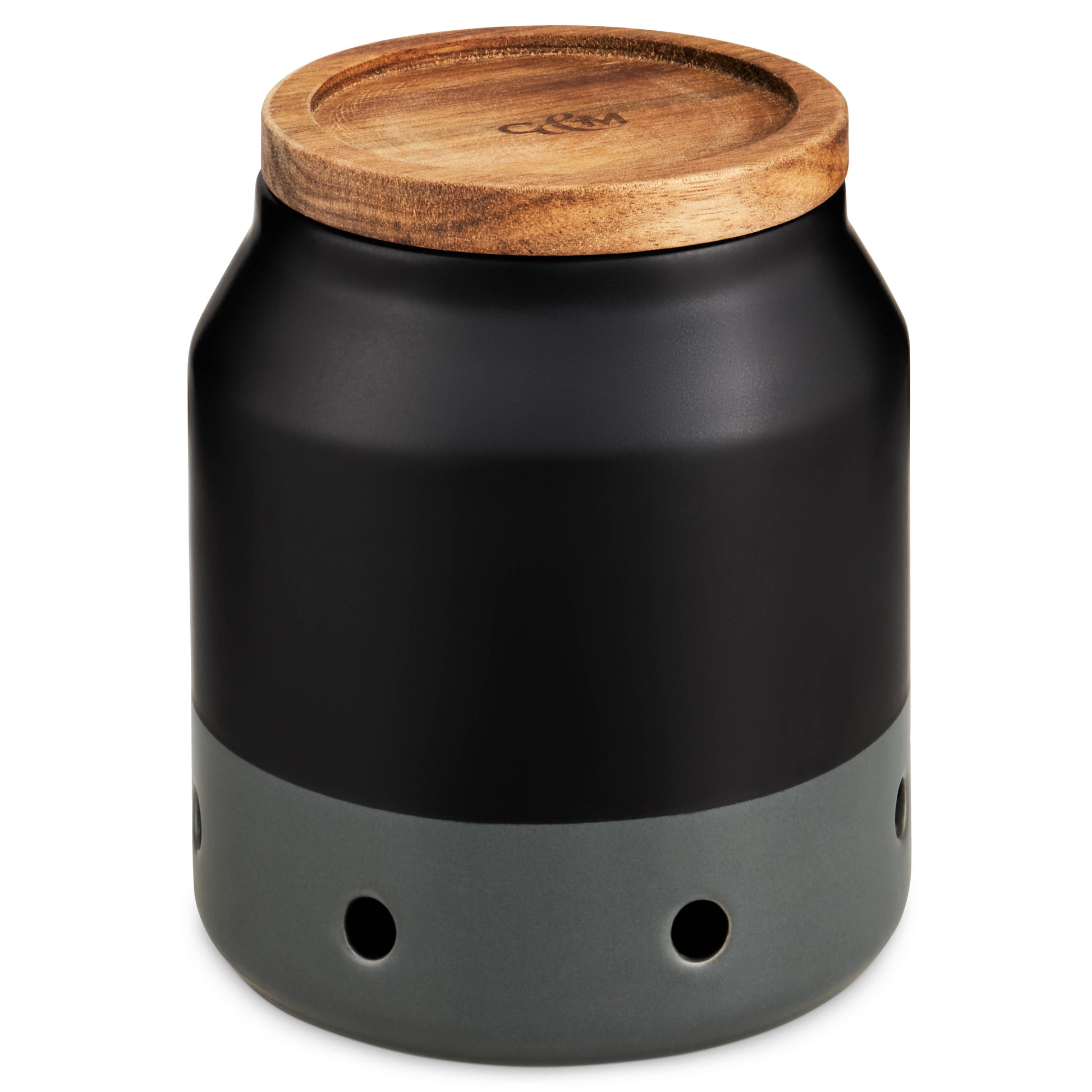 Black garlic keeper with a wooden lid on a white background