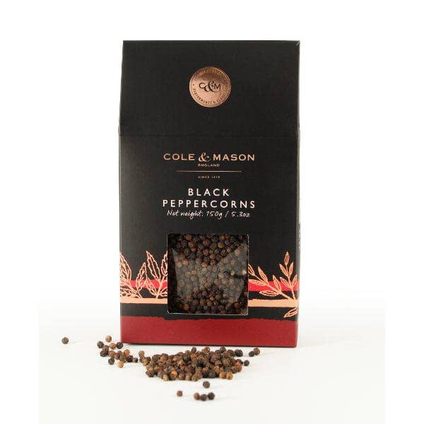 Box of Cole & Mason black peppercorns on a white background