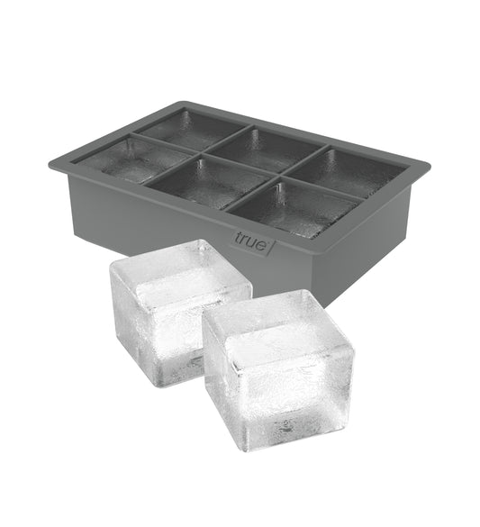 No one wants watered-down cocktails. Our durable Colossal™ Ice Cube Tray provides the solution, popping out six massive cubes that melt slowly to keep your drinks cold without diluting them. Makes six 2'' square cubes. Dishwasher safe silicone.