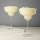 With sleek, modern angles, this margarita coupe offers a contemporary twist on a classic design, making it the perfect companion for a frothy, frozen margarita on a hot summer evening. Crafted from lead-free crystal, each glass holds 12 ounces and comes in a set of two. For lasting brilliance, hand washing is recommended.