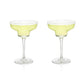 With sleek, modern angles, this margarita coupe offers a contemporary twist on a classic design, making it the perfect companion for a frothy, frozen margarita on a hot summer evening. Crafted from lead-free crystal, each glass holds 12 ounces and comes in a set of two. For lasting brilliance, hand washing is recommended.