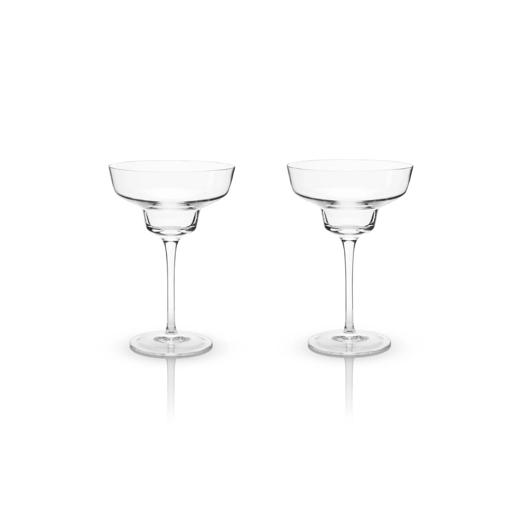 With sleek, modern angles, this margarita coupe offers a contemporary twist on a classic design, making it the perfect companion for a frothy, frozen margarita on a hot summer evening. Crafted from lead-free crystal, each glass holds 12 ounces and comes in a set of two. For lasting brilliance, hand washing is recommended.