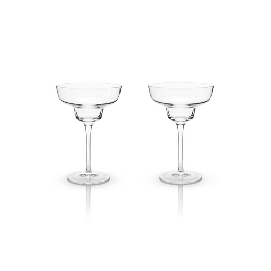 With sleek, modern angles, this margarita coupe offers a contemporary twist on a classic design, making it the perfect companion for a frothy, frozen margarita on a hot summer evening. Crafted from lead-free crystal, each glass holds 12 ounces and comes in a set of two. For lasting brilliance, hand washing is recommended.