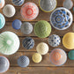 Collection of colorful ceramic bowls on a wooden surface