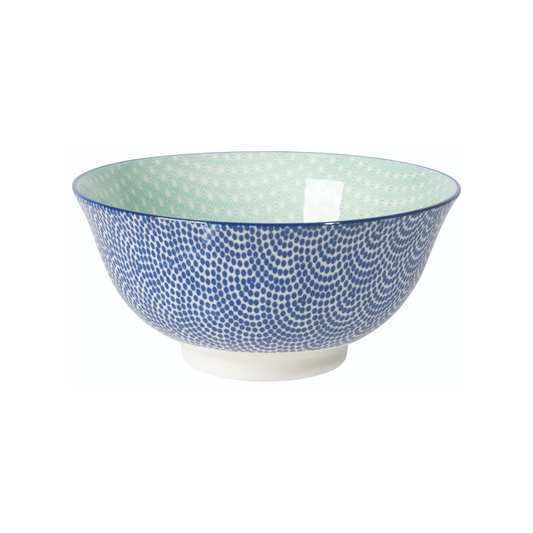 Decorative ceramic bowl with blue and white pattern on a white background