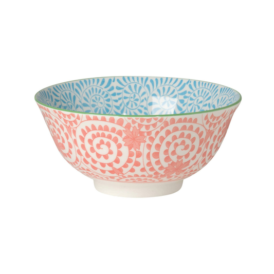 Decorative bowl with pink and blue patterns on a white background