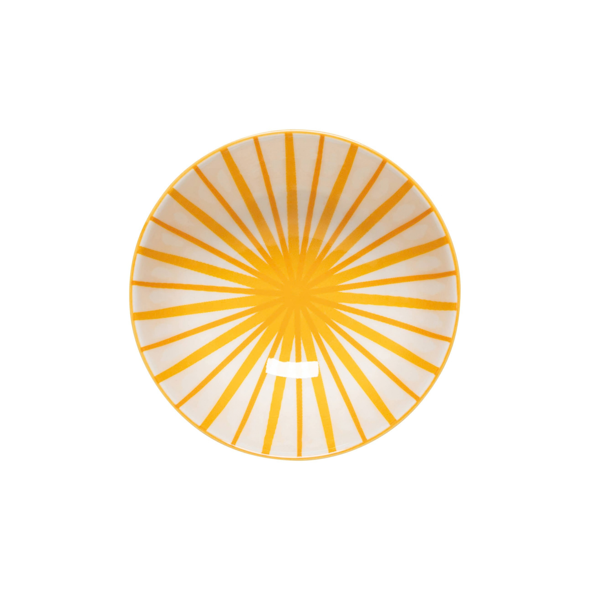 Round plate with yellow radial pattern on a white background