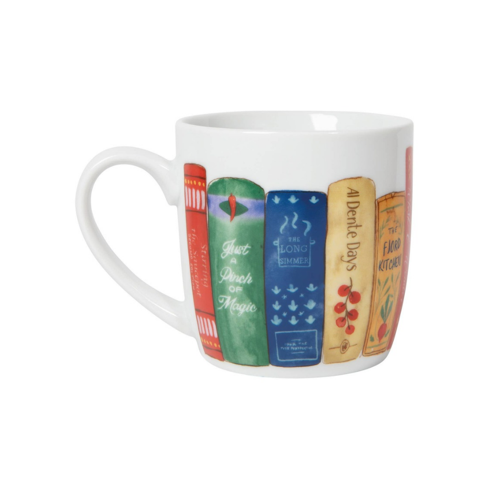 White ceramic mug with colorful cookbooks around the outside on a white background