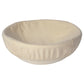 Beige fabric-covered proofing bowl on a white background