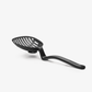 The Lestrain is a large nylon scoop strainer.  Heat resistant and dishwasher safe. The large head sits up off the counter due to a bend in the sturdy handle and there's a nifty catcher underneath the slots to catch any leftover drips! 