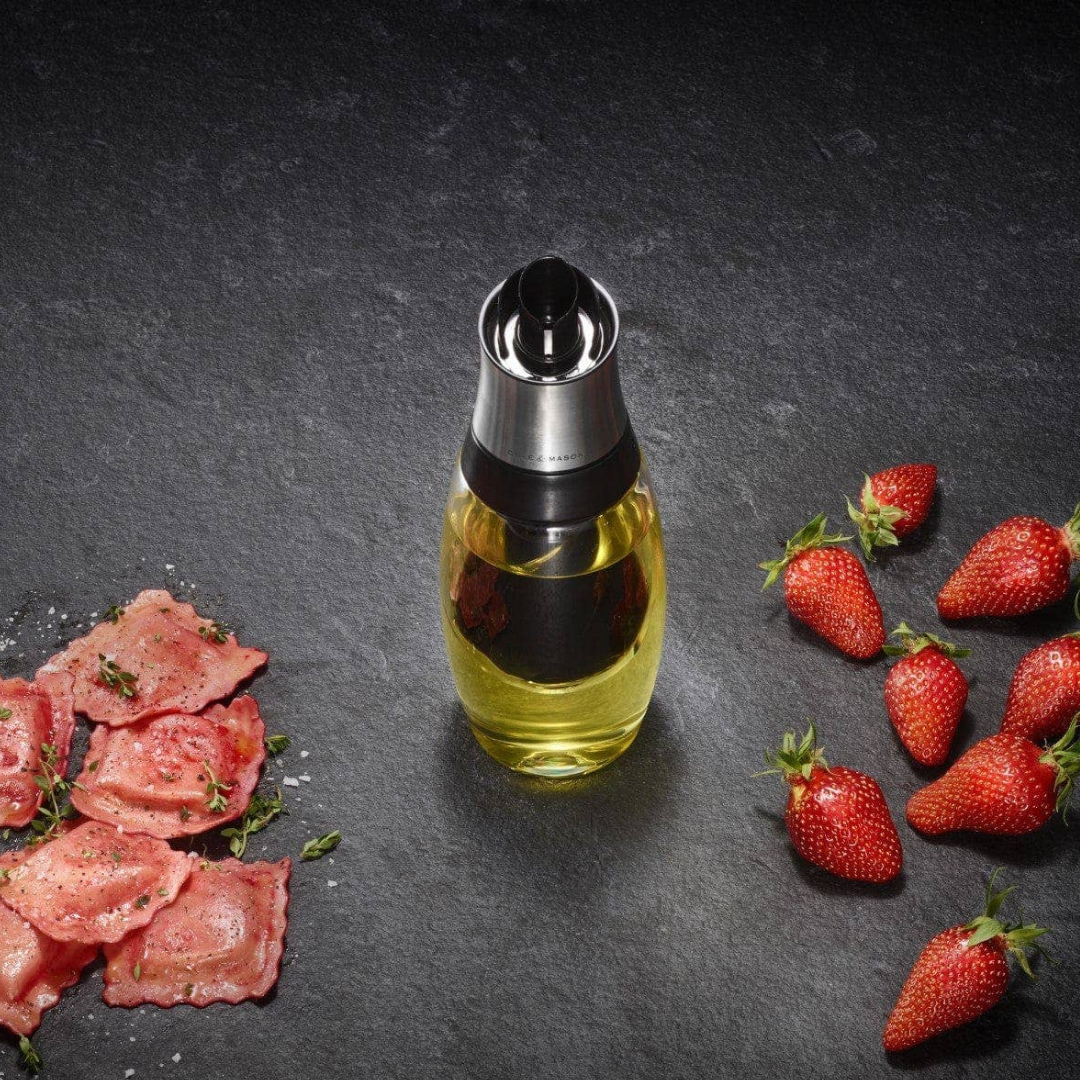 Our Duo Oil & Vinegar Dispenser combines convenience and style, offering the best of both in a single, sleek pourer. Crafted from durable borosilicate glass, it features a stainless steel spout and neck for a modern, functional design.