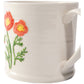 White mug with floral design on a white background