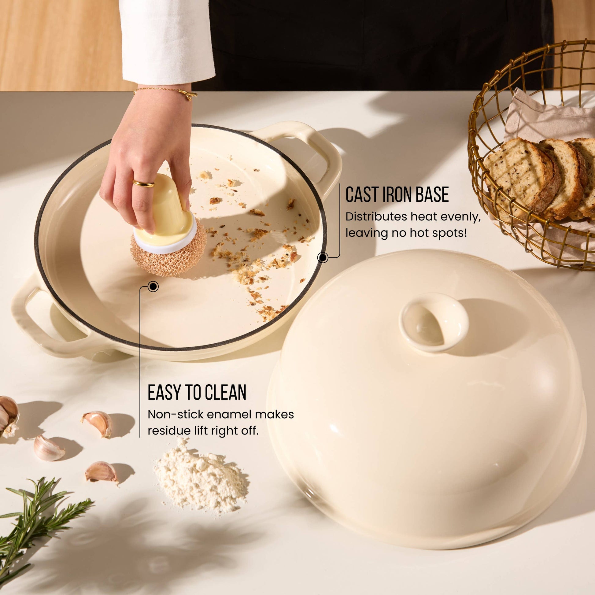 Beige ceramic dish with lid on a light surface, hand cleaning inside the dish.