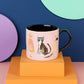 Feline Fine" Mug in a Box is purr-fectly charming! Featuring stylish cats rocking their stripes, spotted sweaters, and even cute boots, this mug is packed with personality. It comes in an adorable gift box