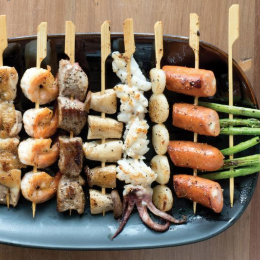 Delightful Flat Bamboo Skewers that are perfect for effortless entertaining! Made from 100% natural bamboo, these sustainable and stylish skewers are grill-ready when soaked overnight. Plus, they're disposable for easy cleanup. Elevate your snacking game with these charming skewers!