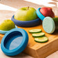 Say goodbye to wasted produce with Ice Blue Food Huggers! This set of five flexible, reusable silicone covers keeps your fruits and veggies fresher for longer while also fitting over jars, open cans, and other small containers. 