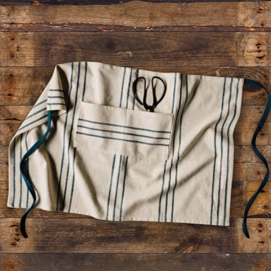 Channel your inner French chef with the charming Vintage French Waist Apron in Camille! Inspired by classic Parisian style, this apron will transport you to a quaint café with its timeless elegance. 