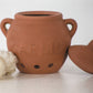 Keep your garlic fresh, organized, and protected with this elegant terra cotta garlic keeper. Made from porous, unglazed stoneware with vent holes, it promotes proper airflow to keep garlic cool, dry, and long-lasting.