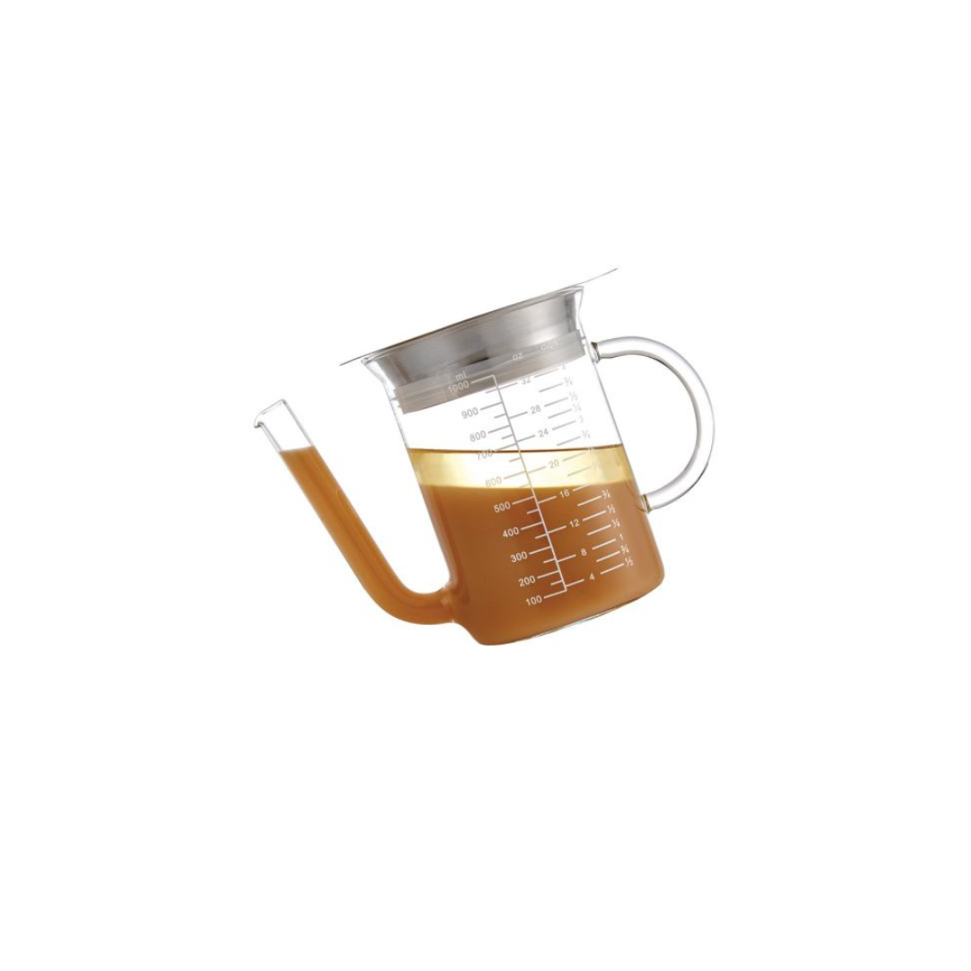 Smooth, flavorful gravy every time with this 32oz Glass Gravy Strainer. Made of durable borosilicate glass, stainless steel, and food-safe silicone, it's perfect for sauces, broths, and more. Easy-to-read measurements and a low-set spout make for mess-free pouring. Safe for stovetop and microwave use. Say goodbye to lumpy sauces and hello to perfection!