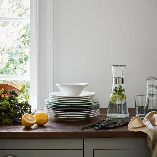 This sleek, minimalist design, complete with a chic stainless steel collar, is the perfect way to serve ice-cold water with a twist—add fresh mint, citrus slices, or frozen berries for a refreshing upgrade. Whether it’s for a casual meal or a formal dinner, this stylish carafe blends seamlessly with any tableware or cutlery, making it a versatile and practical addition to your collection.