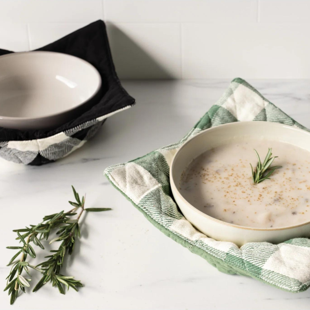 Bowl Cozy - Elm Green, holding a bowl of soup on a counter