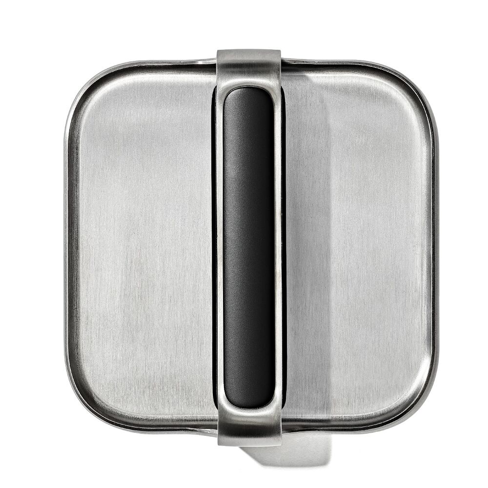 Top view of metal griddle press with black handle. 