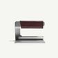 Metallic stand with a brown leather strip on a white background