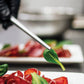 Dolci's product on a plate with a close-up of a leaf