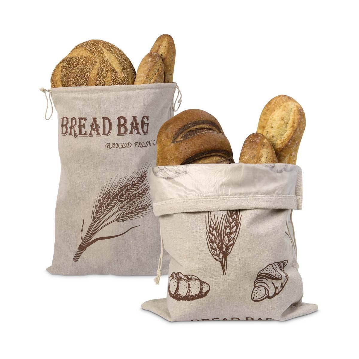 Two bread bags with printed designs filled with bread on a white background