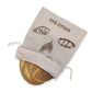 Fabric bread bag with bread illustration and text on a white background