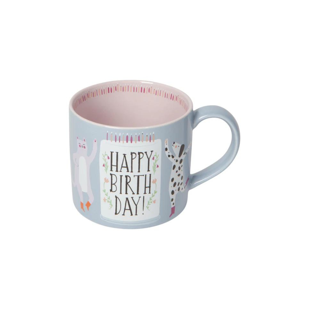 the "Happy Birthday" Mug in a Box! Featuring an adorable dancing cat and dog in their cutest boots, this mug is ready to bring the party. It comes in a charming gift box that’s perfect for storing little treasures after the big day.