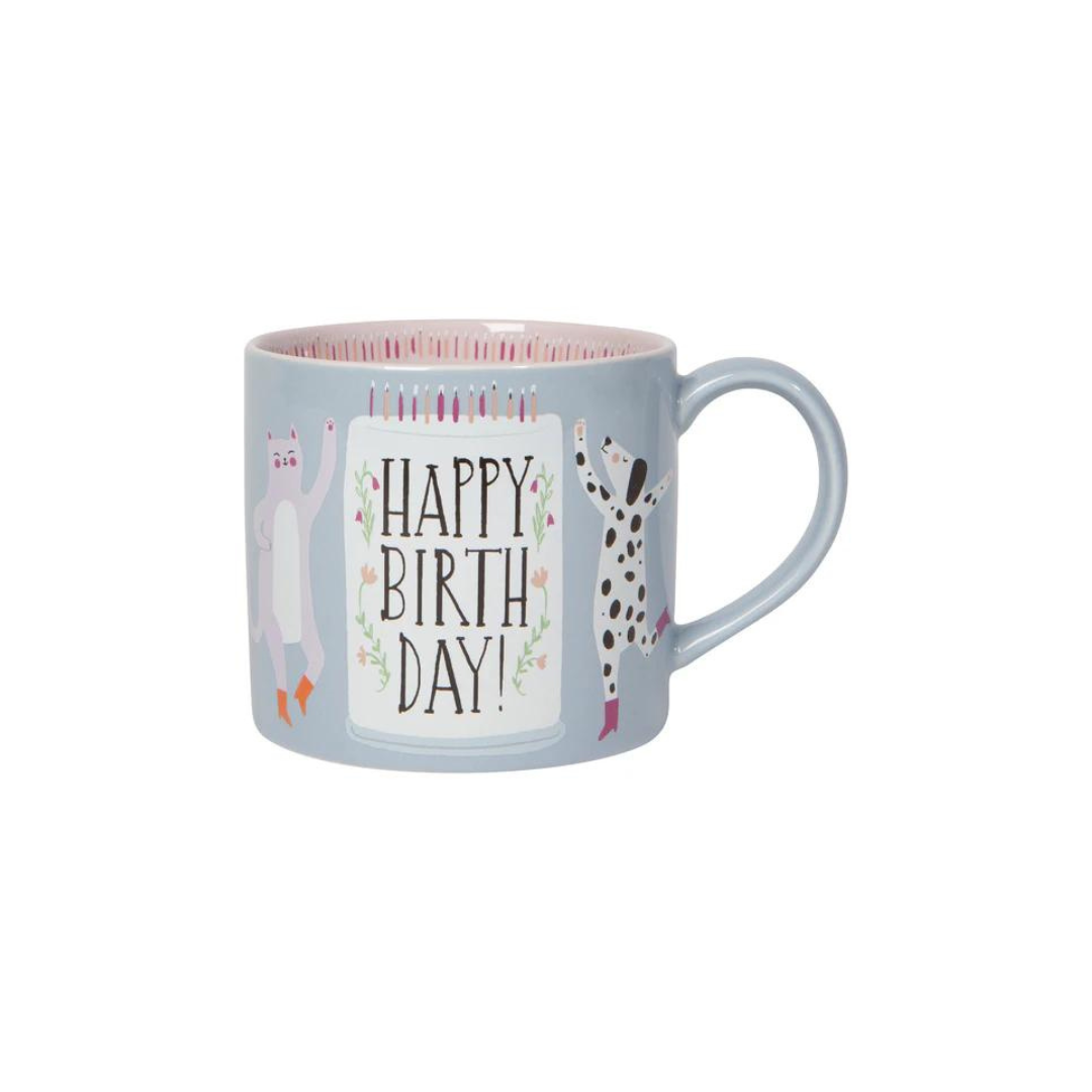 the "Happy Birthday" Mug in a Box! Featuring an adorable dancing cat and dog in their cutest boots, this mug is ready to bring the party. It comes in a charming gift box that’s perfect for storing little treasures after the big day.