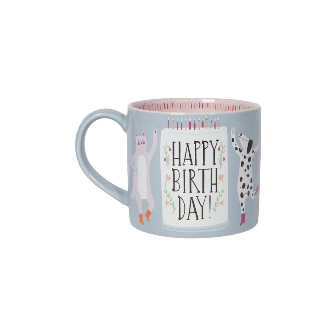 the "Happy Birthday" Mug in a Box! Featuring an adorable dancing cat and dog in their cutest boots, this mug is ready to bring the party. It comes in a charming gift box that’s perfect for storing little treasures after the big day.