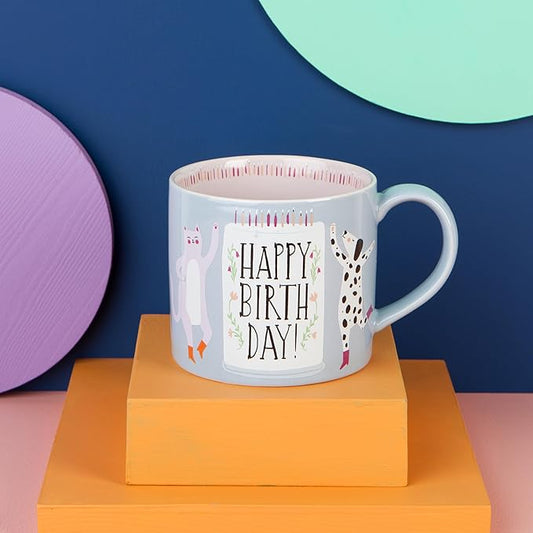 the "Happy Birthday" Mug in a Box! Featuring an adorable dancing cat and dog in their cutest boots, this mug is ready to bring the party. It comes in a charming gift box that’s perfect for storing little treasures after the big day.