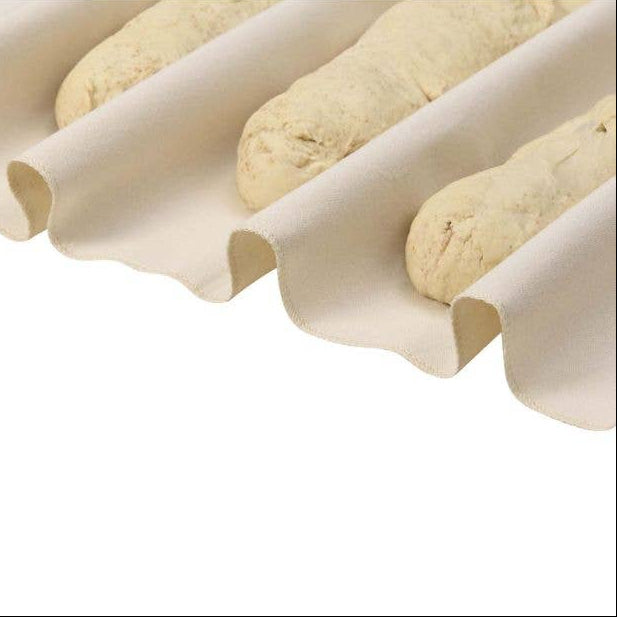 Three rolled dough pieces on a white surface with a white background