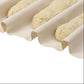 Three rolled dough pieces on a white surface with a white background