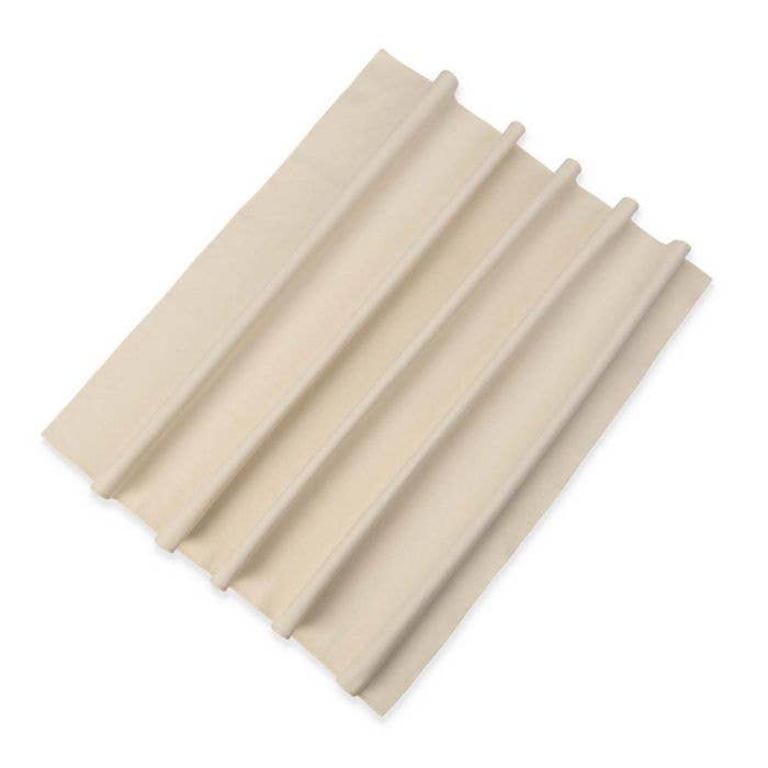 Beige corrugated plastic sheet on a white background