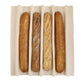 Four baguettes in a white container on a white background