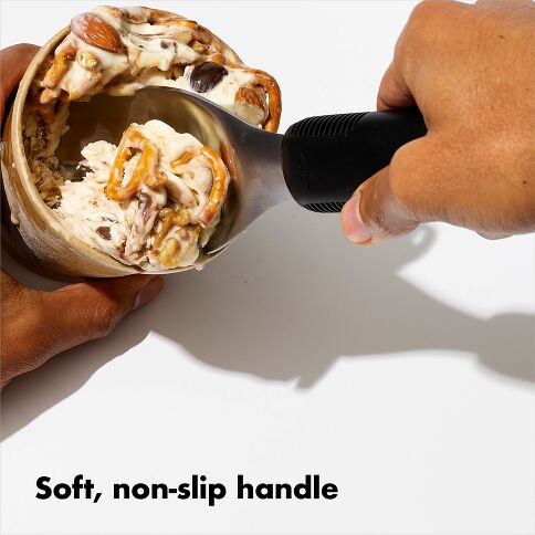 Revolutionize your ice cream serving experience with the OXO Good Grips Ice Cream Spade, expertly engineered for effortless scooping and generous portions. The wide stainless steel head slices through frozen desserts with remarkable ease while maintaining the durability needed for repacking store-bought pints. 