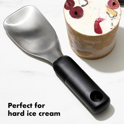 Revolutionize your ice cream serving experience with the OXO Good Grips Ice Cream Spade, expertly engineered for effortless scooping and generous portions. The wide stainless steel head slices through frozen desserts with remarkable ease while maintaining the durability needed for repacking store-bought pints. 